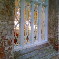 Exterior painted window at Hursley village hall